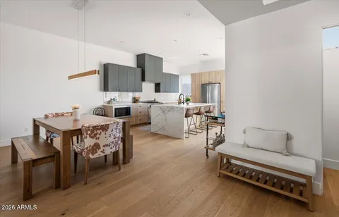 a kitchen with stainless steel appliances a sink stove and cabinets