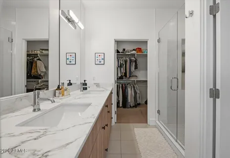a kitchen with a sink stove top oven and cabinets