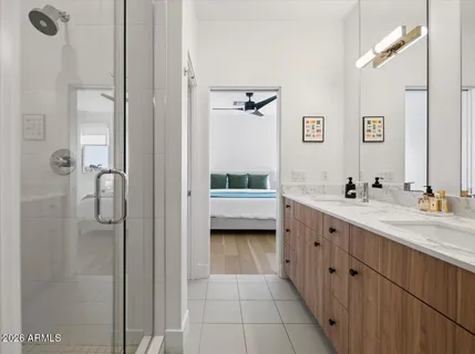 a kitchen with a sink stove and wooden floor