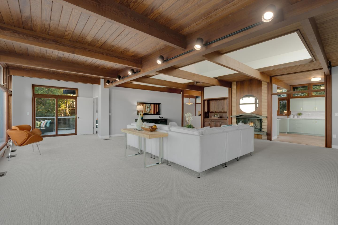 21221 Canyon View Drive Saratoga, CA 95070 - Photo 17 of 45 a living room with furniture and a flat screen tv