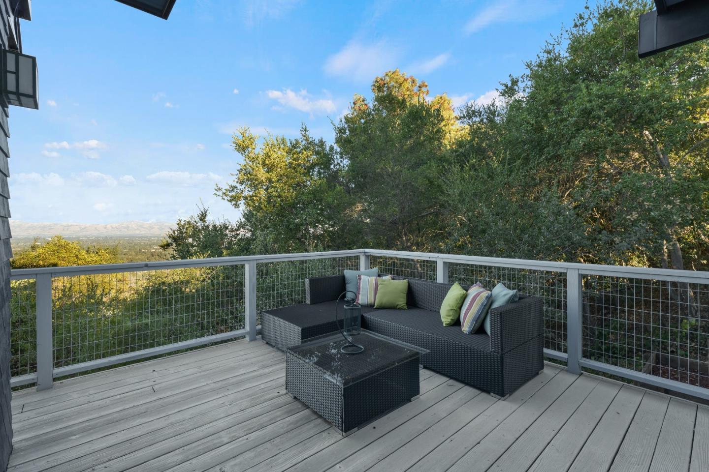 21221 Canyon View Drive Saratoga, CA 95070 - Photo 18 of 45 a balcony with wooden floor table and chairs