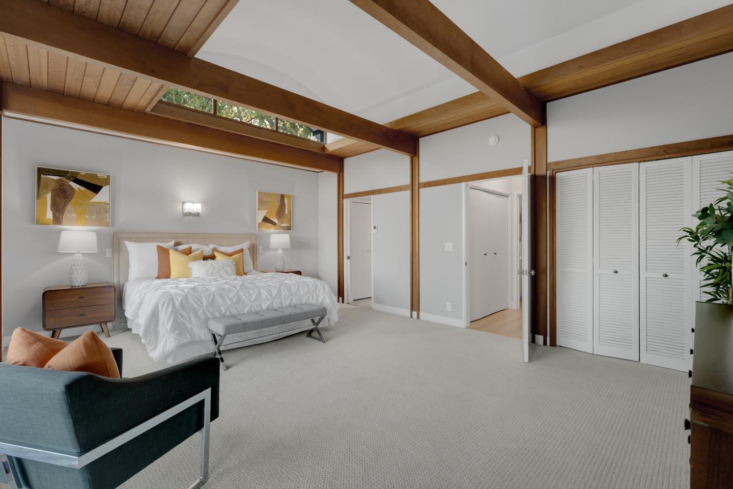 21221 Canyon View Drive Saratoga, CA 95070 - Photo 25 of 45 a bedroom with a bed and a mirror