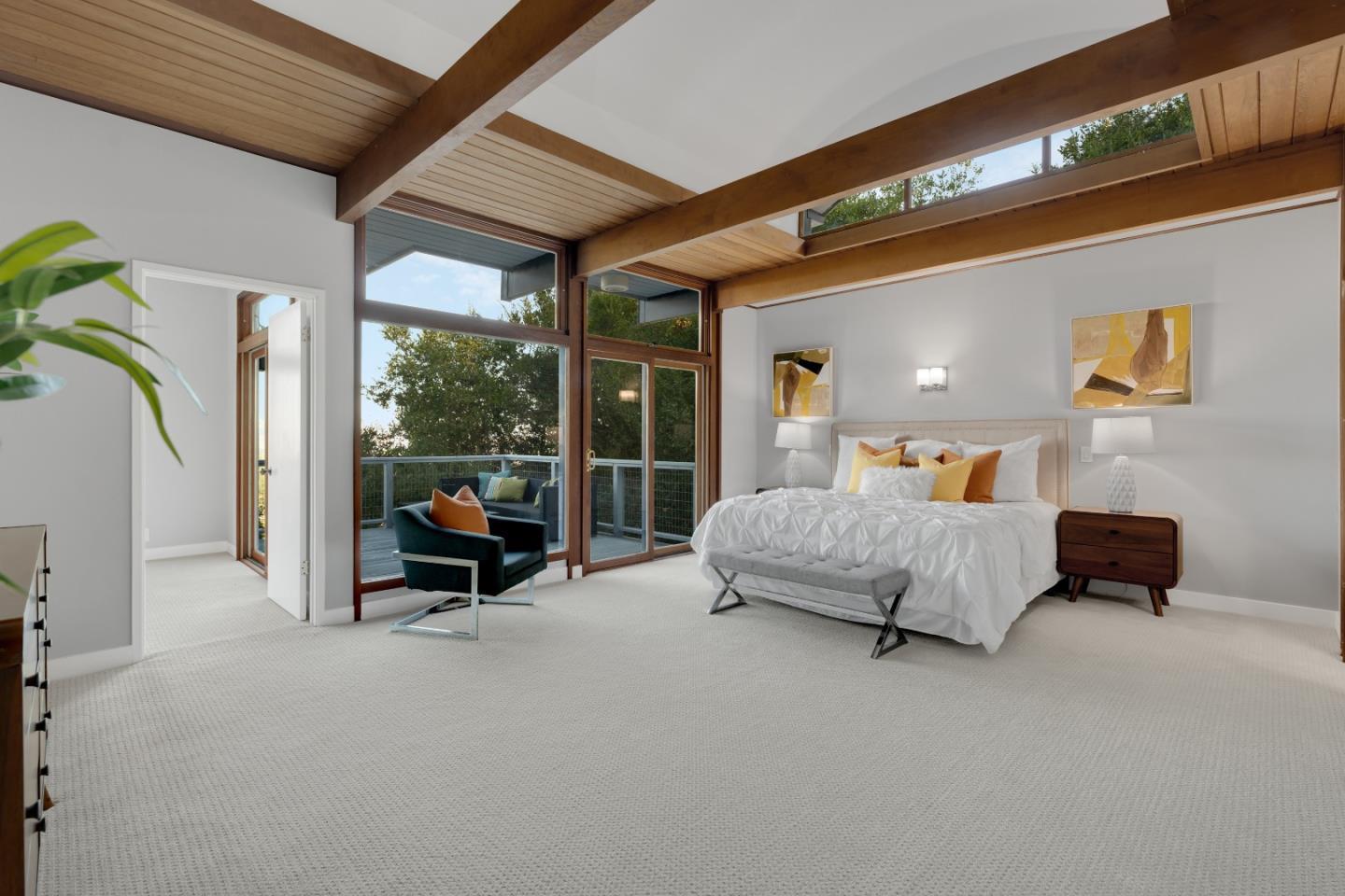 21221 Canyon View Drive Saratoga, CA 95070 - Photo 26 of 45 a bedroom with furniture and a large window