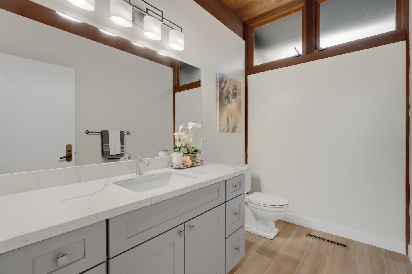 21221 Canyon View Drive Saratoga, CA 95070 - Photo 30 of 45 a bathroom with a sink a toilet and a mirror