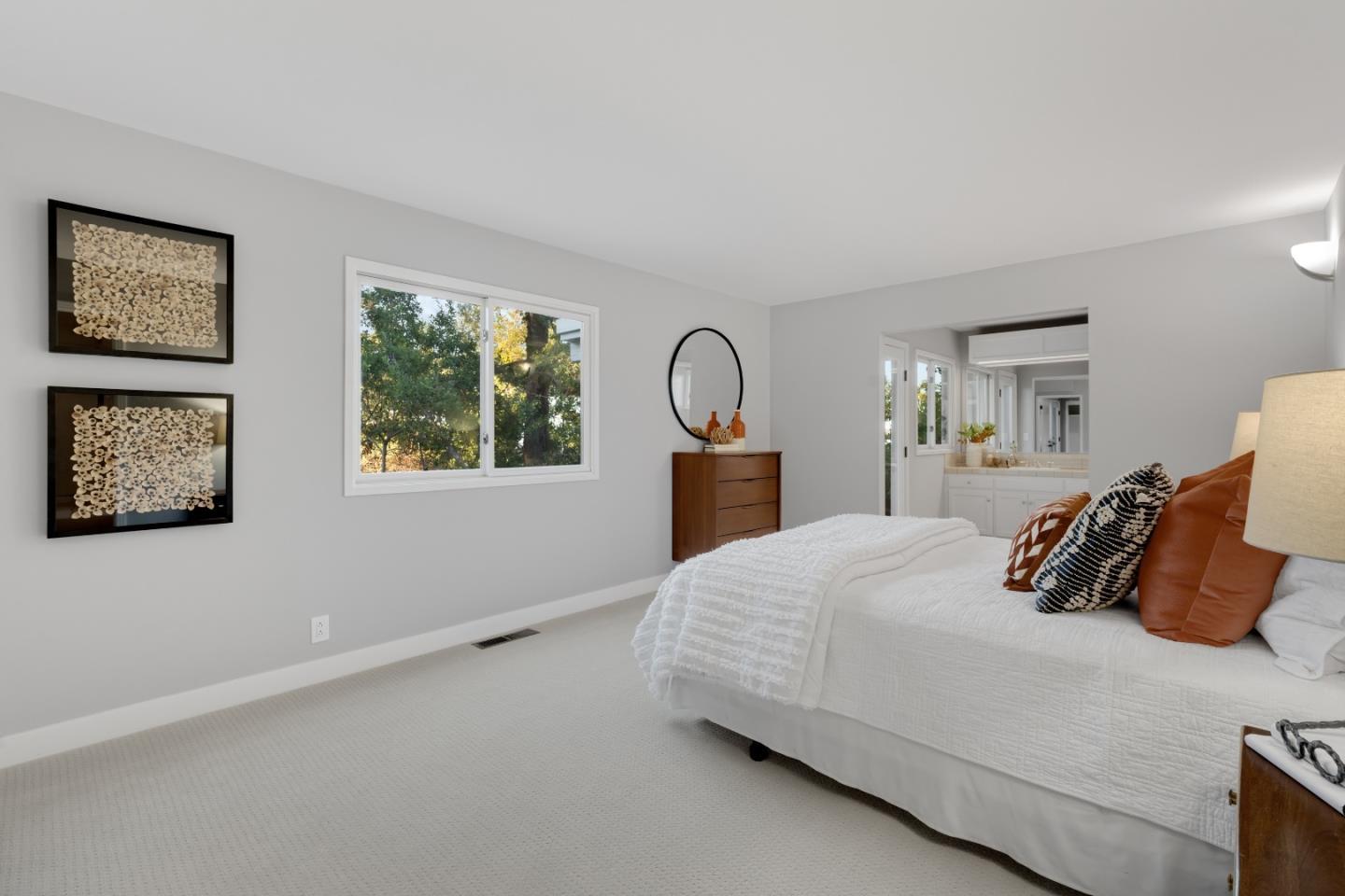 21221 Canyon View Drive Saratoga, CA 95070 - Photo 31 of 45 a bedroom with a large bed and a window