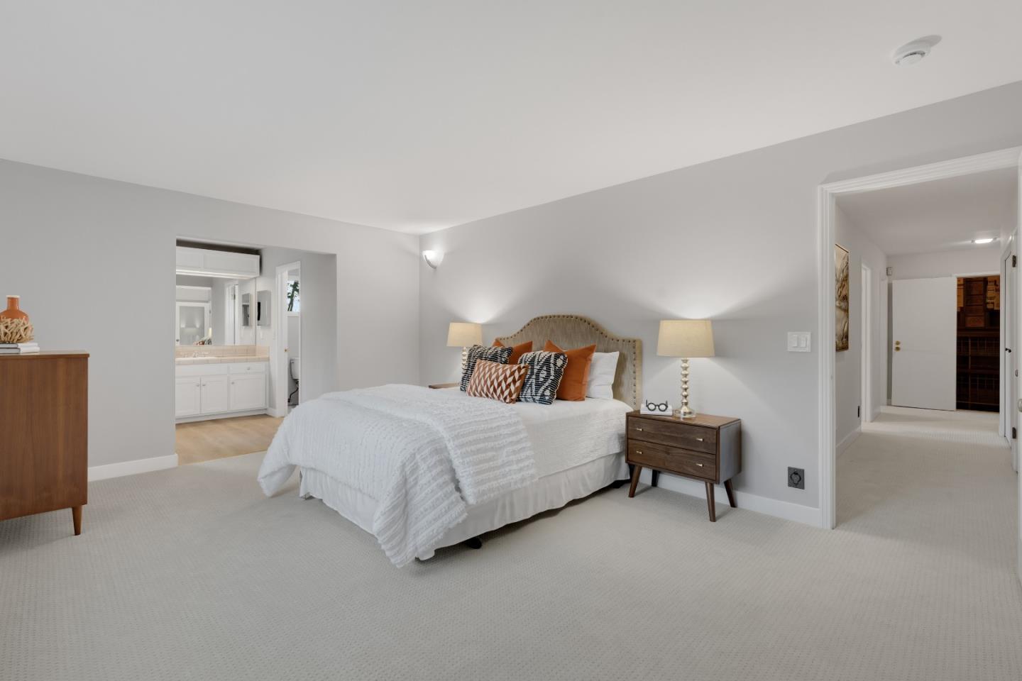 21221 Canyon View Drive Saratoga, CA 95070 - Photo 32 of 45 a bedroom with a bed and a lamp on table