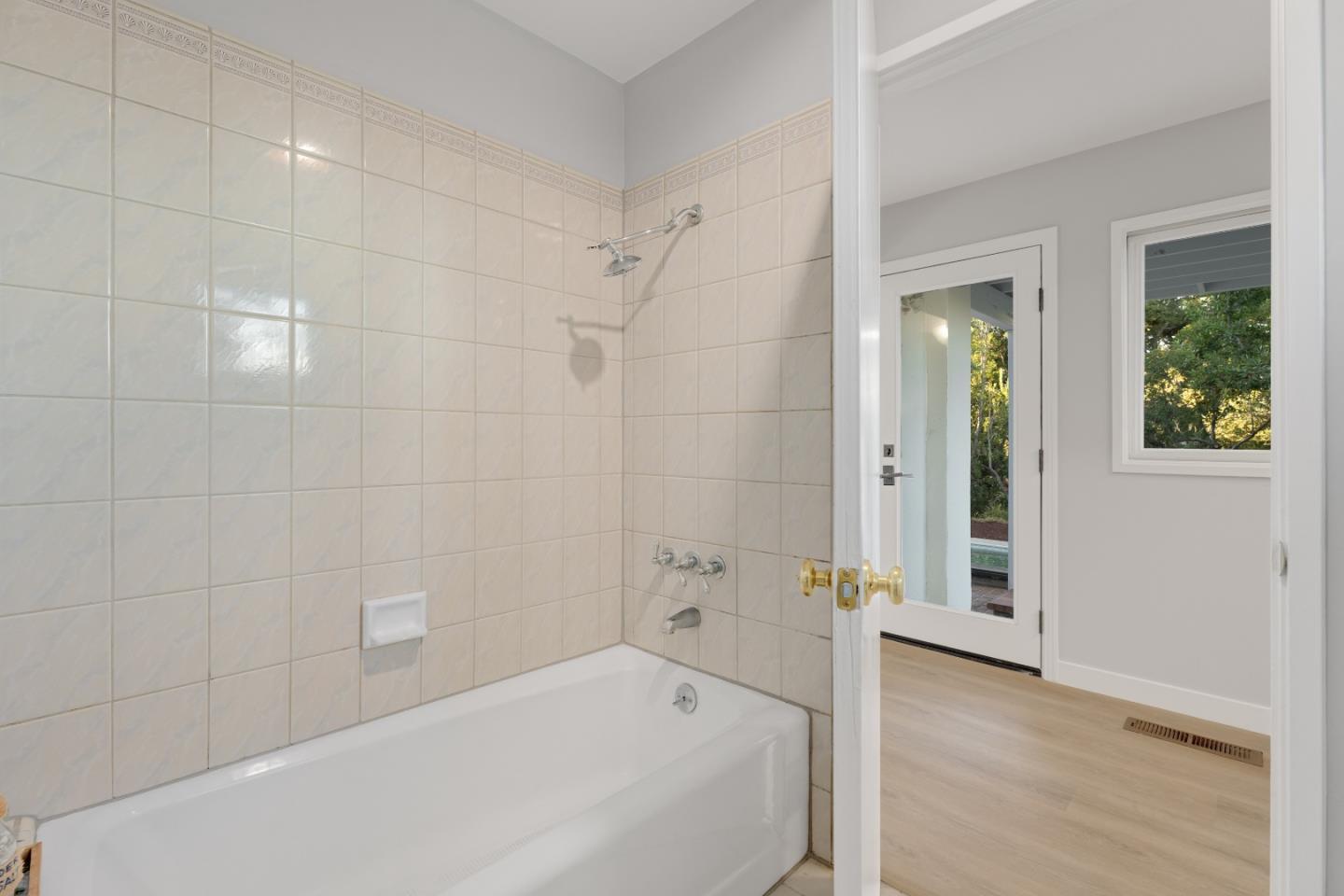 21221 Canyon View Drive Saratoga, CA 95070 - Photo 34 of 45 a bathroom with a bathtub and a shower