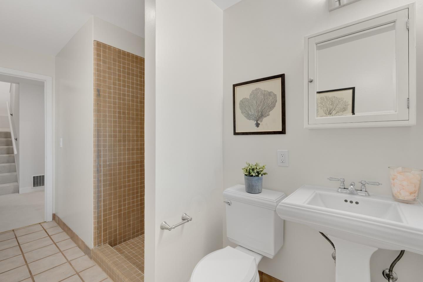 21221 Canyon View Drive Saratoga, CA 95070 - Photo 38 of 45 a bathroom with a sink mirror and toilet