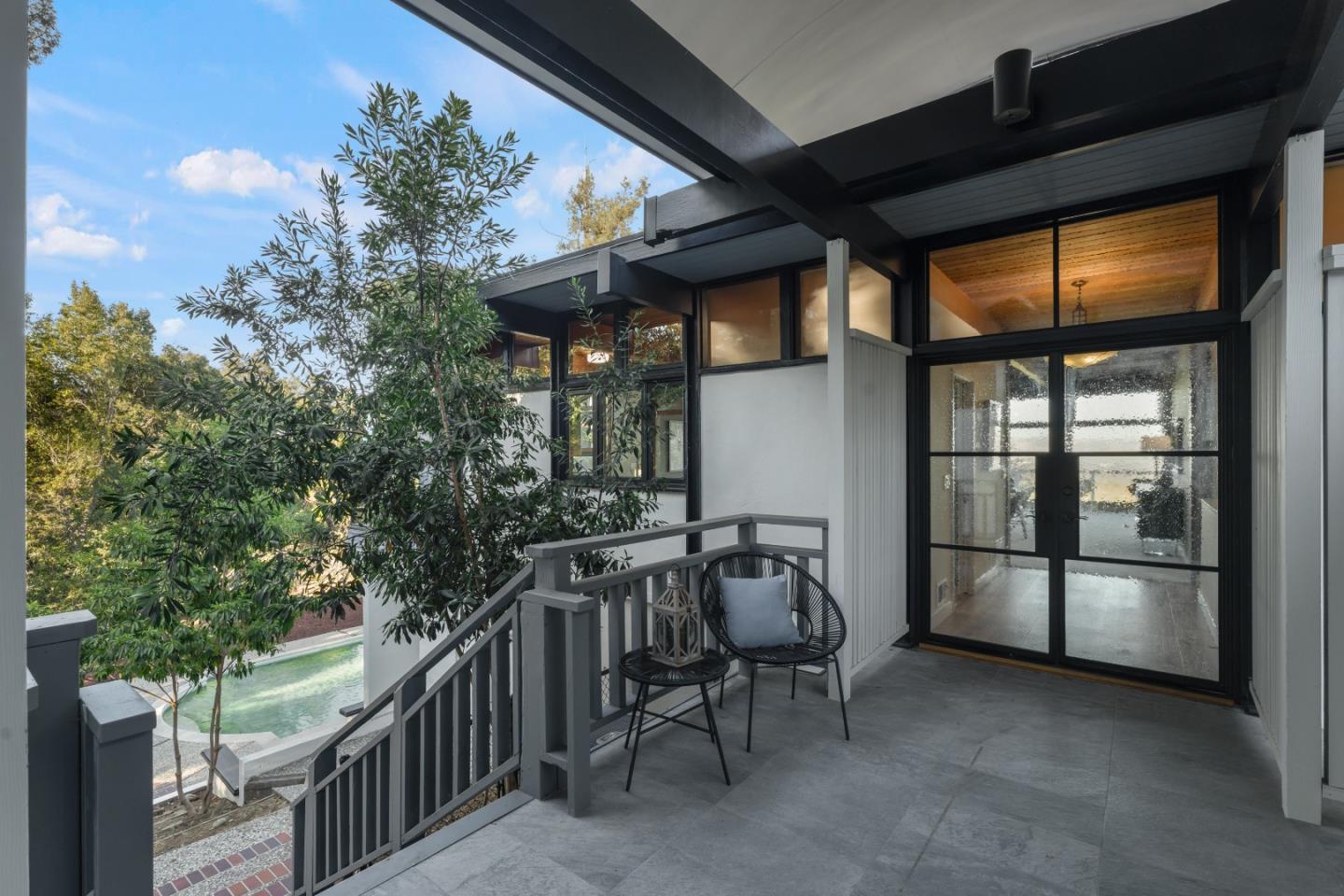 21221 Canyon View Drive Saratoga, CA 95070 - Photo 4 of 45 a view of a porch with furniture and a yard