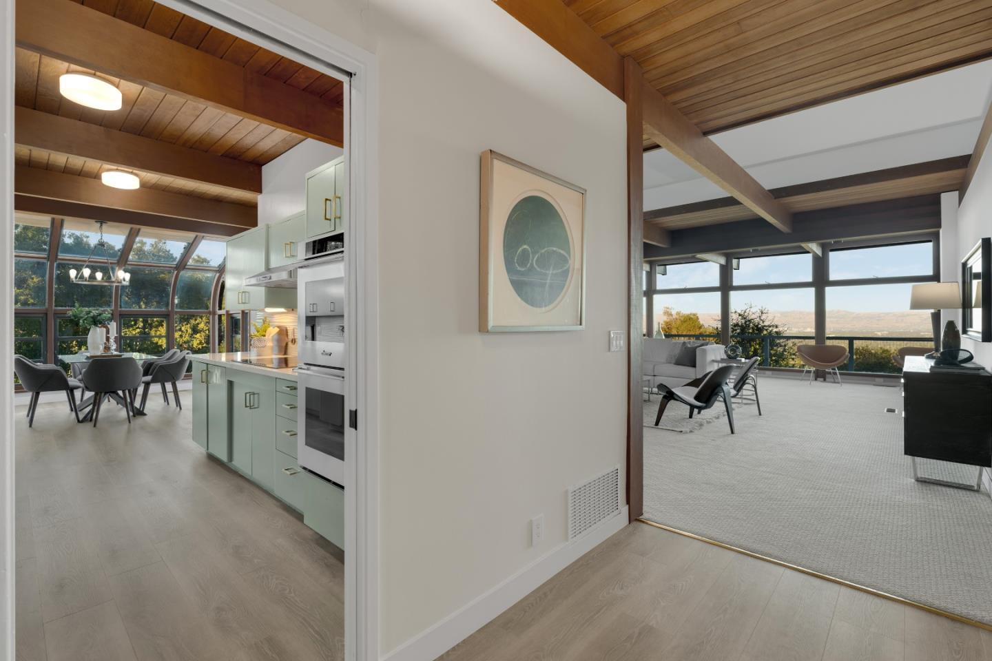 21221 Canyon View Drive Saratoga, CA 95070 - Photo 6 of 45 a view of a dining room with furniture and a kitchen view