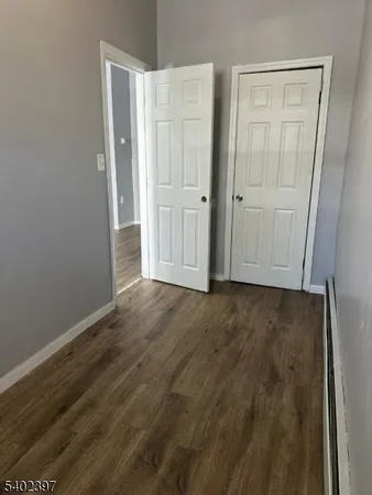 an empty room with wooden floor