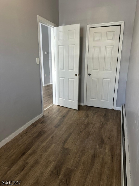 8 4th Street Passaic, NJ 07055 - Photo 9 of 10 an empty room with wooden floor