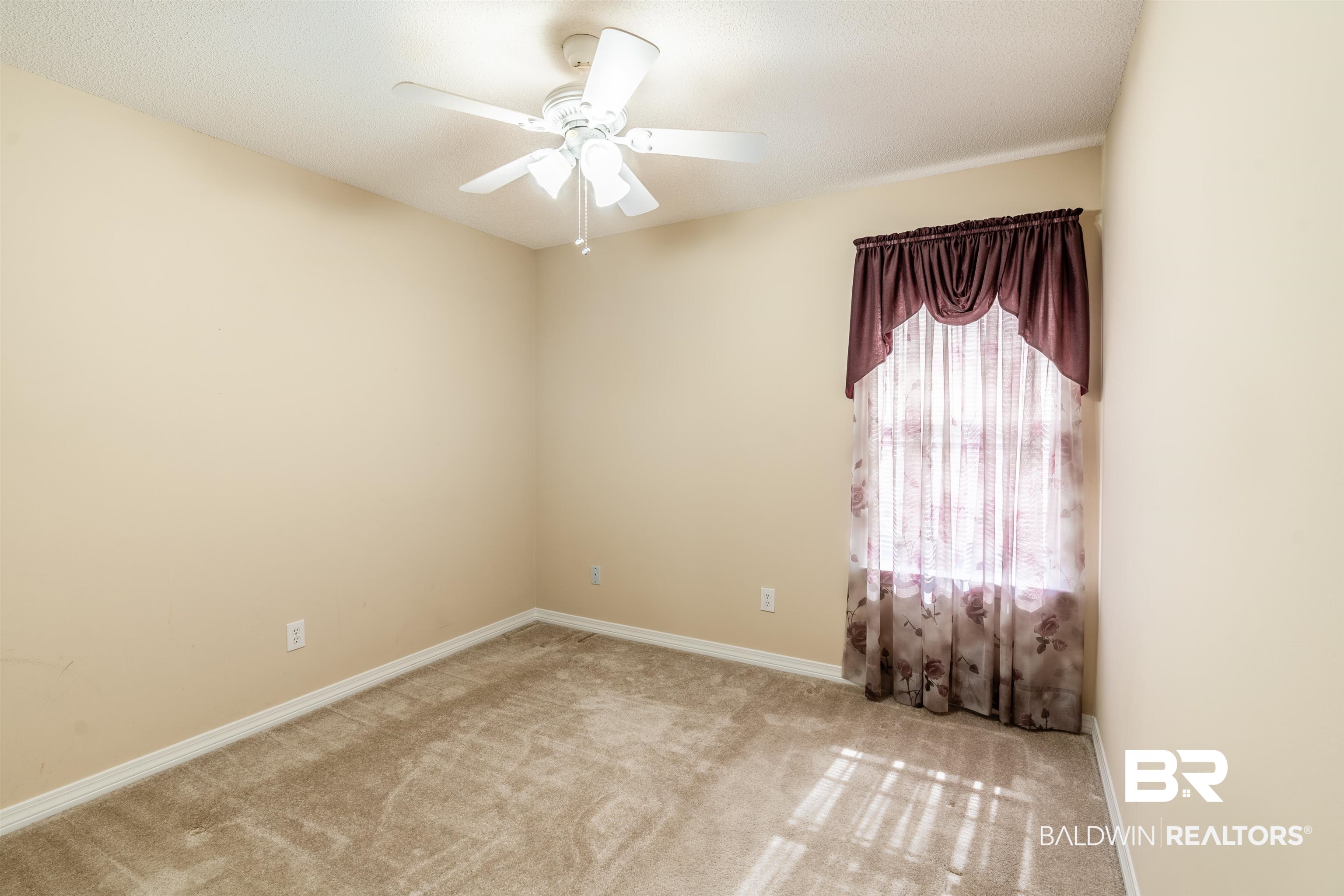 1784 Harrington Way Mobile, AL 36695 - Photo 16 of 18 Carpeted spare room featuring ceiling fan