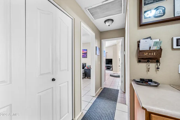 a hallway with furniture and wooden floor