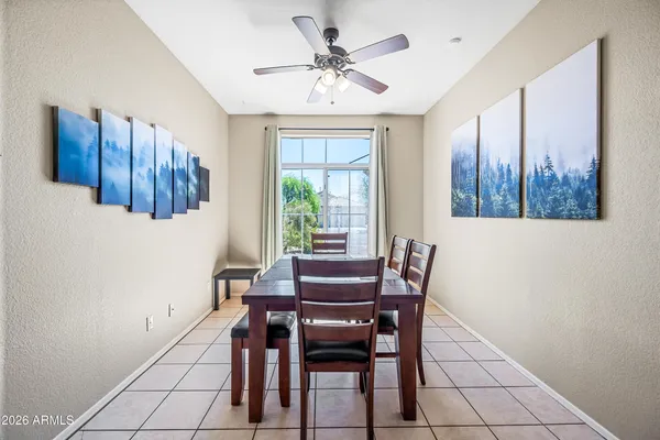 a dining room with furniture and window
