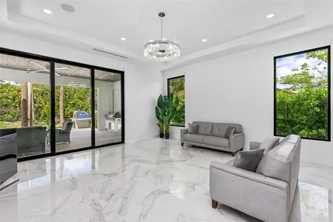 a view of staircase with white walls and a rug