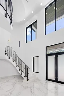 a bathroom with a shower and a glass door