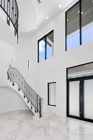a bathroom with a shower and a glass door