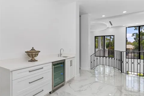 a bathroom with a sink toilet and mirror