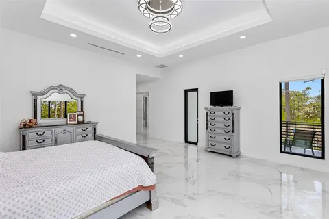 a bathroom with a sink vanity mirror and toilet