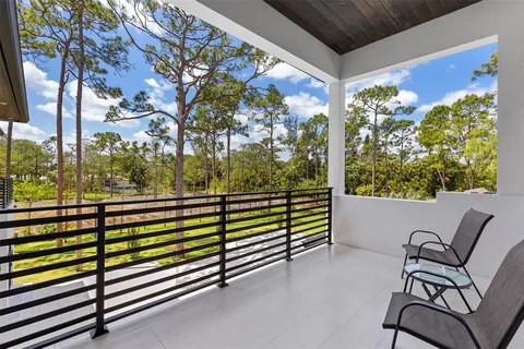 a view of an outdoor dining space with a table and chairs