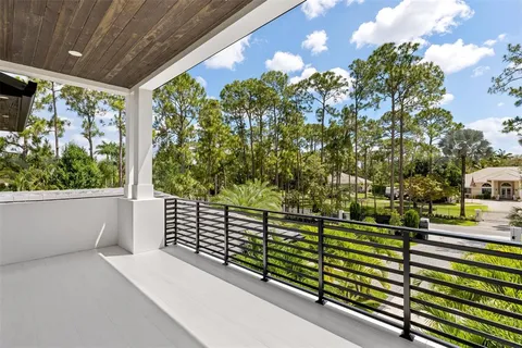 a view of a park with large trees