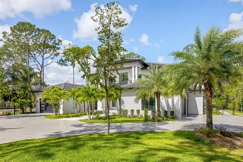 a view of an empty room with glass door and balcony