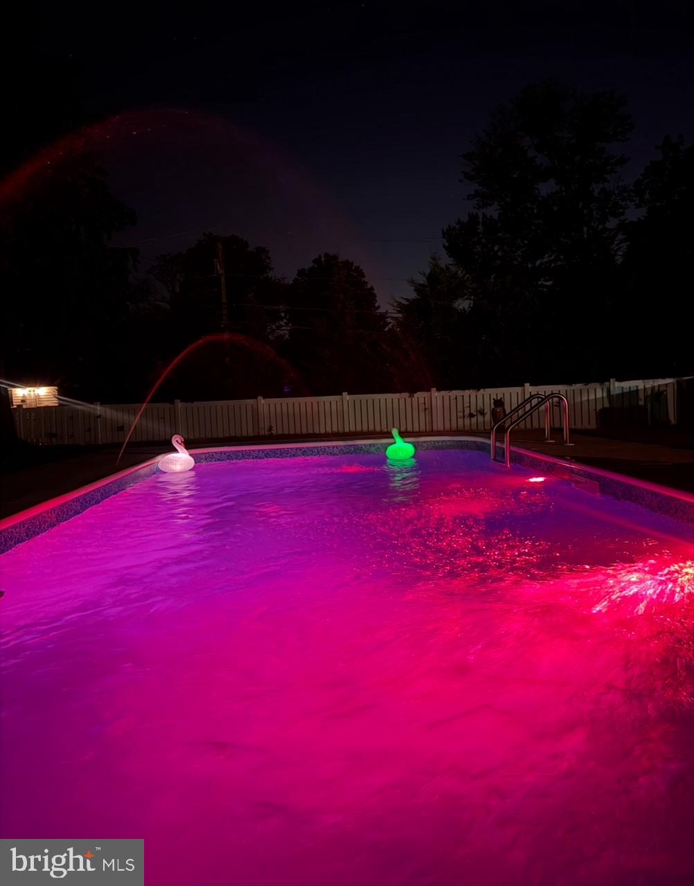 303 Main Street Mantua, NJ 08051 - Photo 41 of 50 a view of swimming pool with lawn chairs and plants