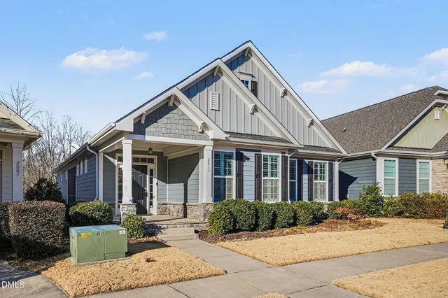 a front view of a house with yard