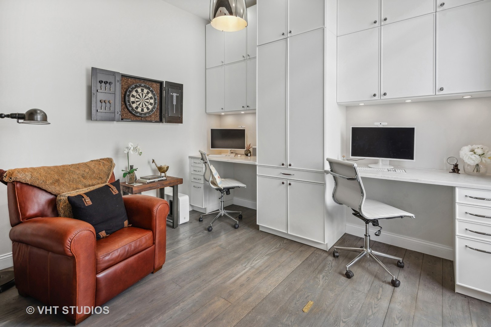 215 West Illinois Street, Unit 3A Chicago, IL 60654 - Photo 16 of 18 a work room with furniture and wooden floor