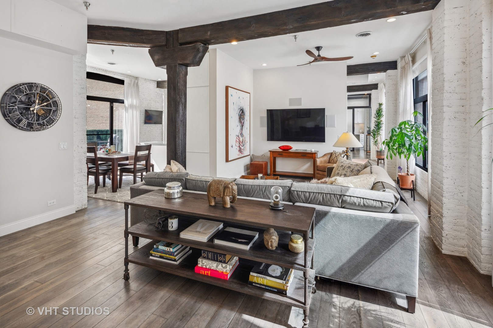 215 West Illinois Street, Unit 3A Chicago, IL 60654 - Photo 3 of 18 a work room with furniture a flat screen tv and a window