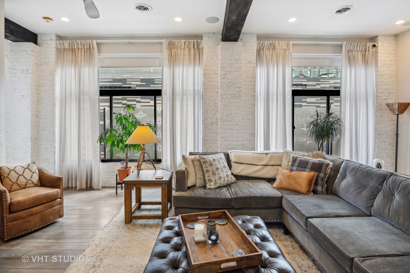 215 West Illinois Street, Unit 3A Chicago, IL 60654 - Photo 5 of 18 a living room with furniture and a large window
