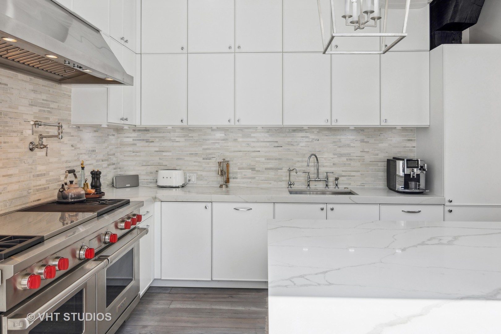 215 West Illinois Street, Unit 3A Chicago, IL 60654 - Photo 10 of 18 a kitchen with stainless steel appliances granite countertop a sink stove and white cabinets