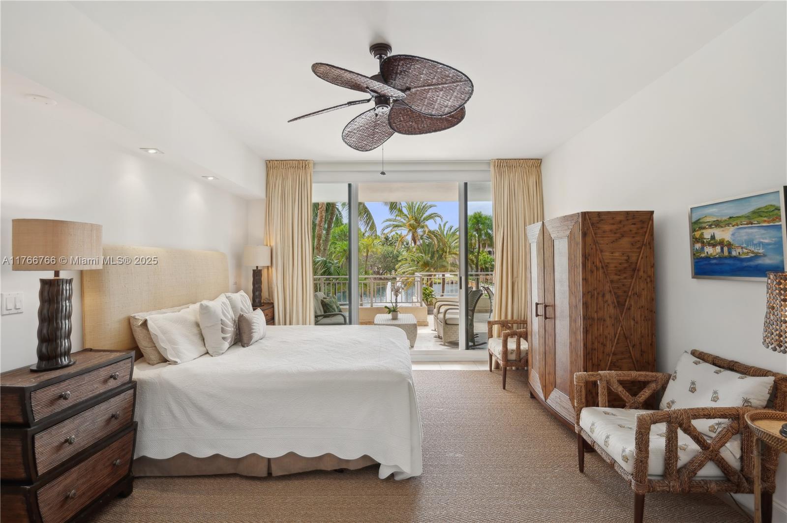 765 Crandon Boulevard, Unit 111 Key Biscayne, FL 33149 - Photo 12 of 57 a bedroom with a bed and a large window