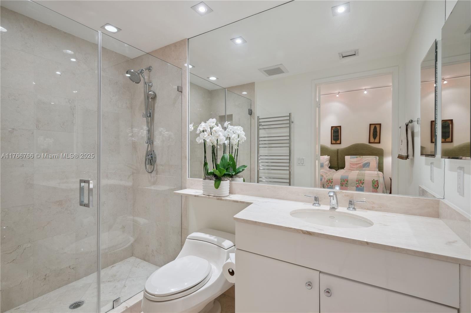765 Crandon Boulevard, Unit 111 Key Biscayne, FL 33149 - Photo 17 of 57 a bathroom with a sink toilet and shower