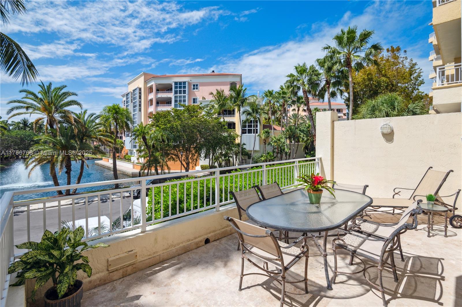 765 Crandon Boulevard, Unit 111 Key Biscayne, FL 33149 - Photo 2 of 57 a view of a chairs and table in the patio