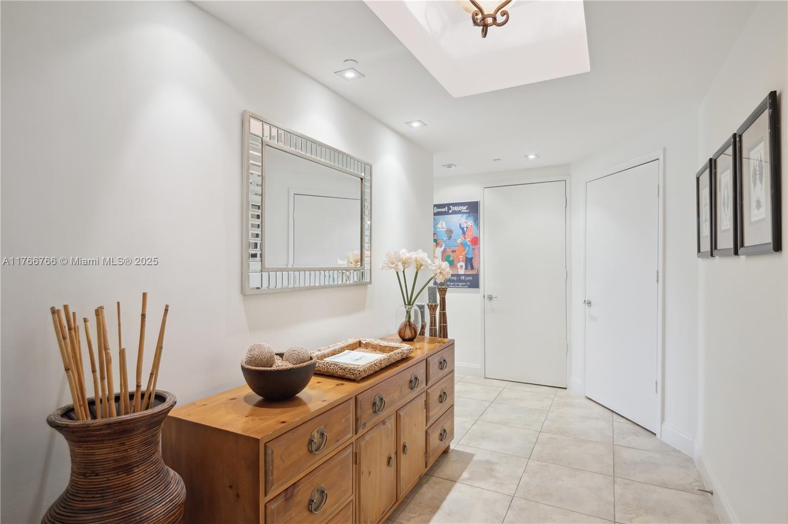 765 Crandon Boulevard, Unit 111 Key Biscayne, FL 33149 - Photo 4 of 57 a kitchen with stainless steel appliances granite countertop a sink and a stove