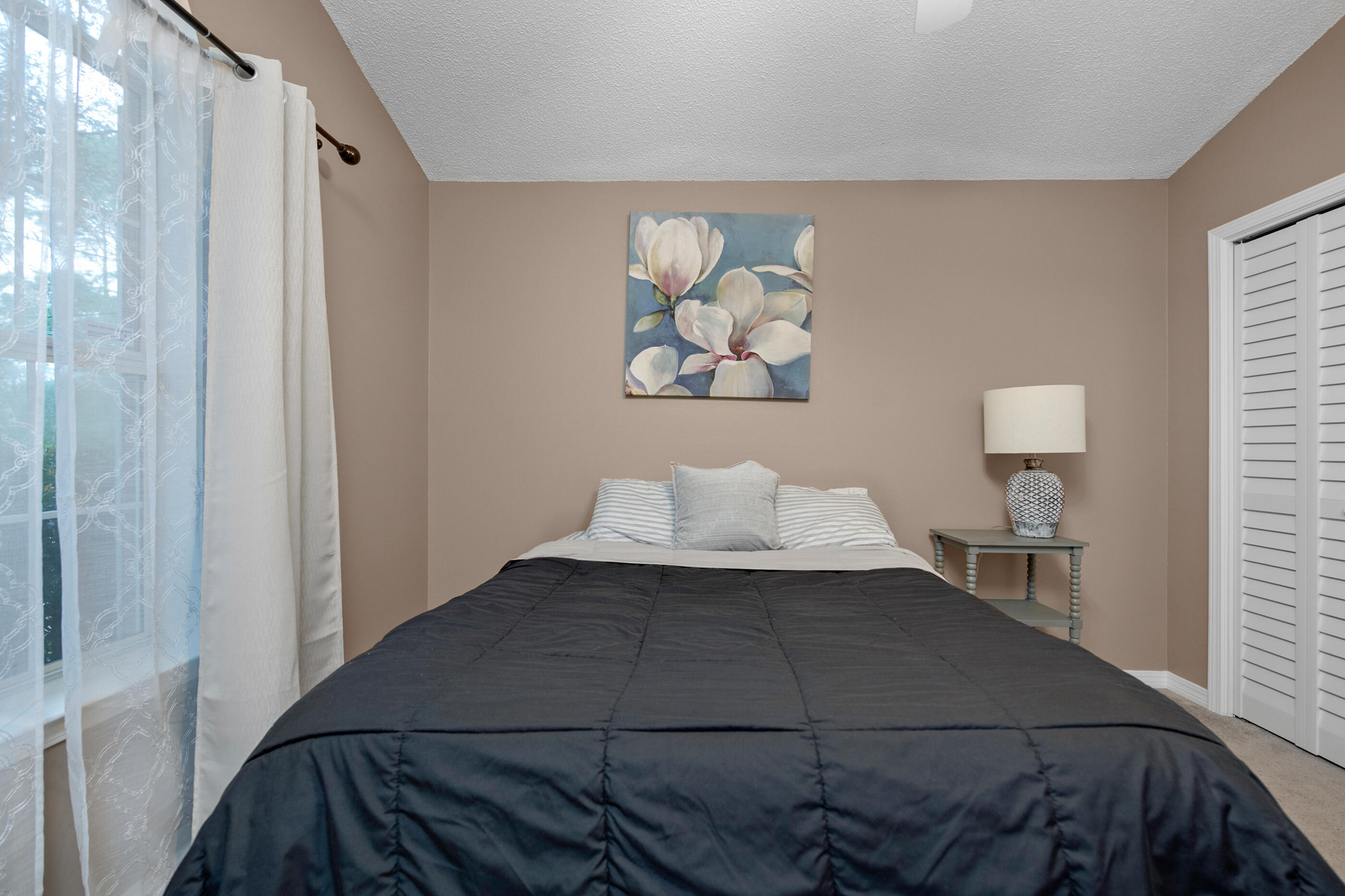 4439 Antioch Road Crestview, FL 32536 - Photo 16 of 32 a bedroom with a bed and a window