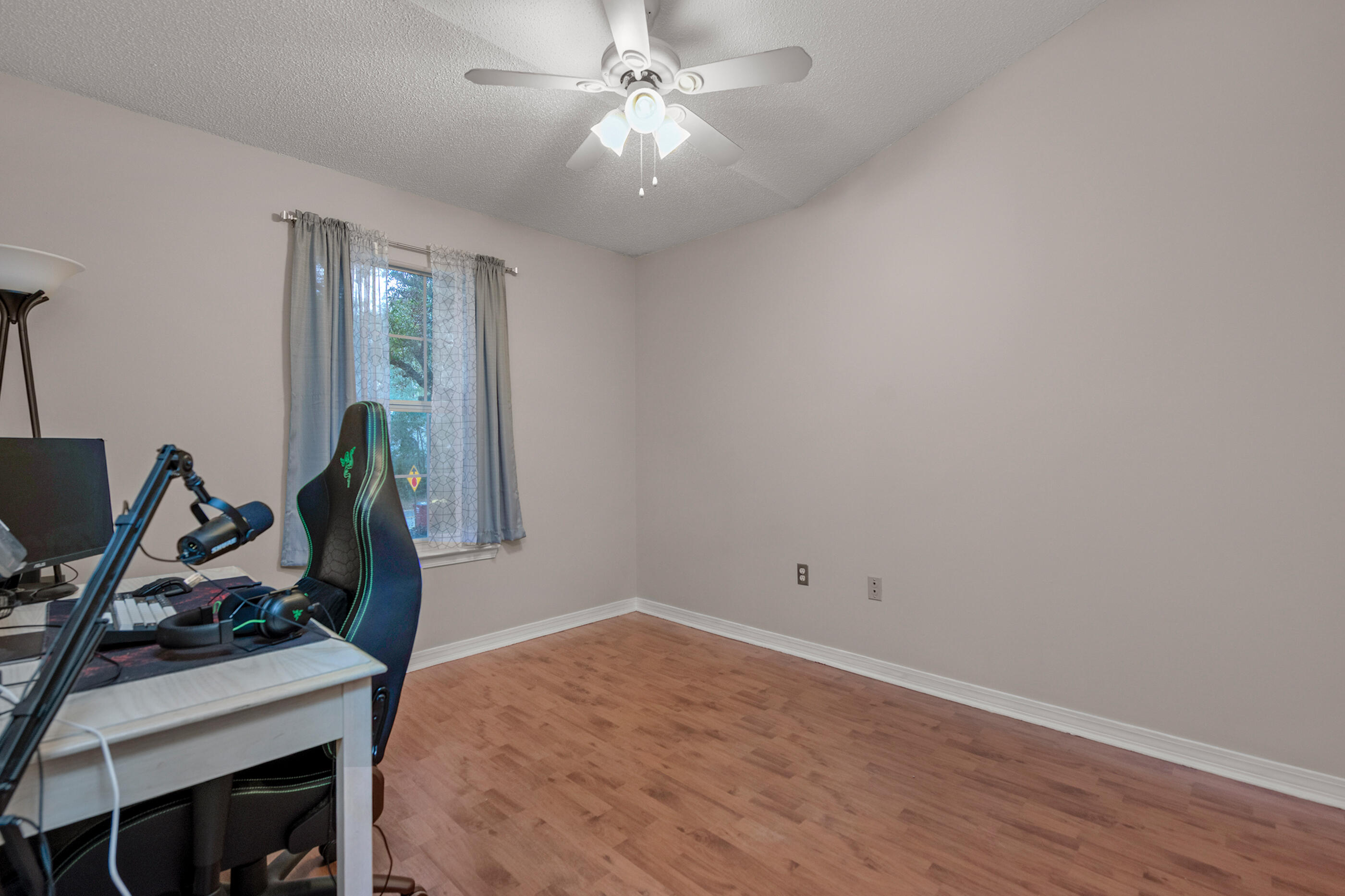 4439 Antioch Road Crestview, FL 32536 - Photo 17 of 32 a view of a room with gym equipment