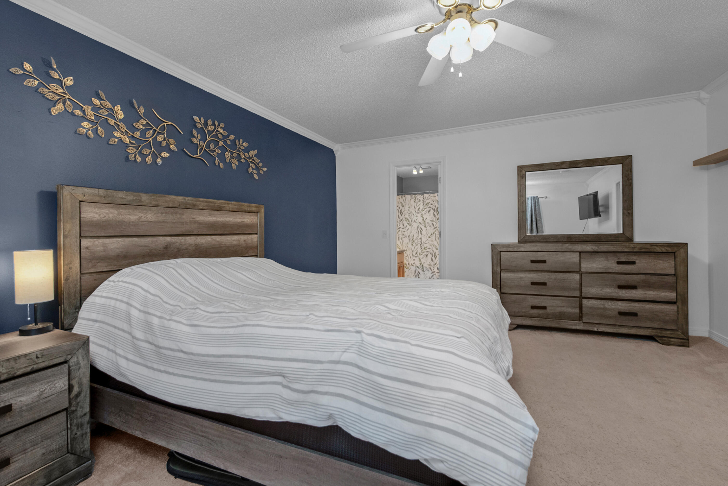 4439 Antioch Road Crestview, FL 32536 - Photo 21 of 32 a bedroom with a bed and a chandelier