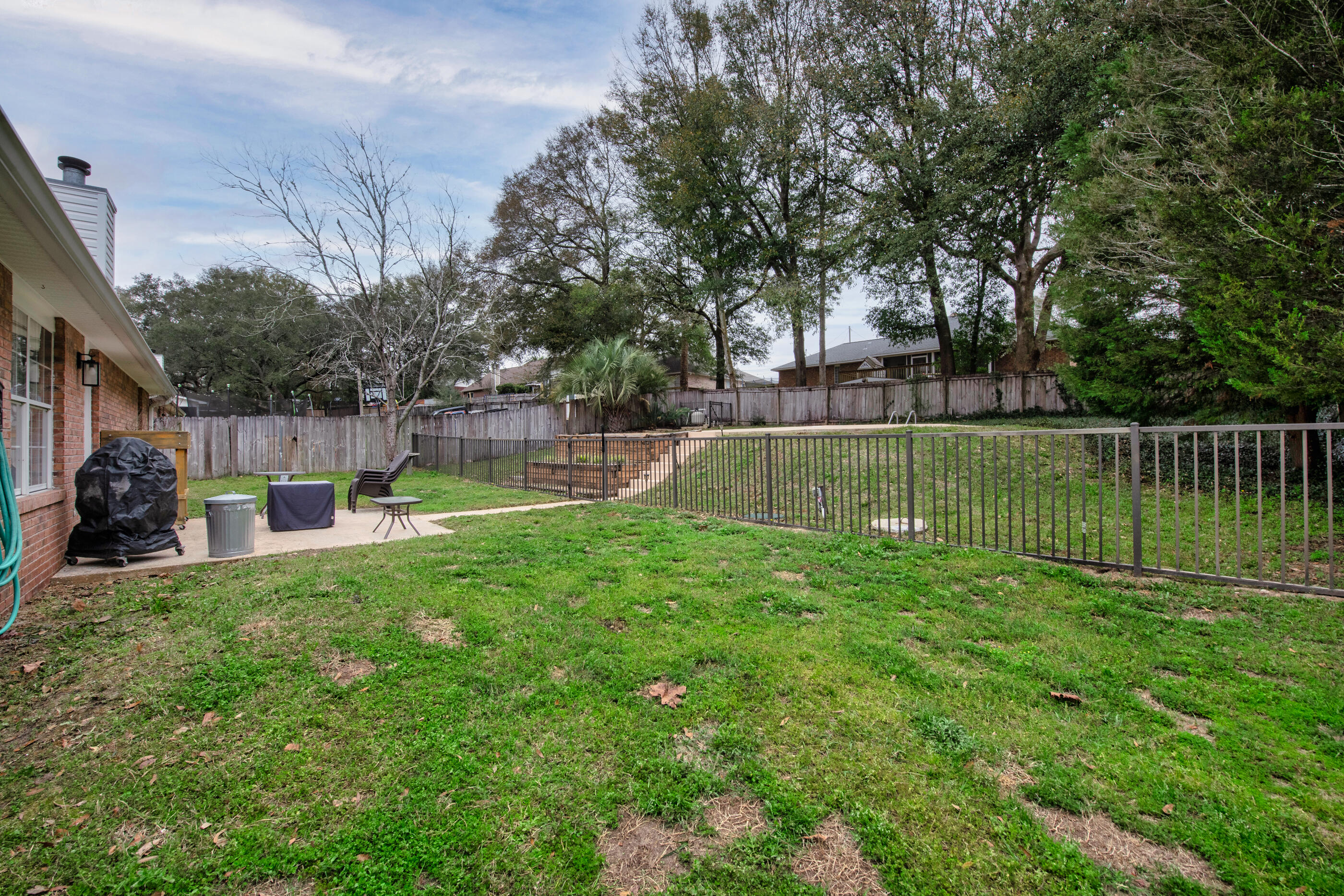 4439 Antioch Road Crestview, FL 32536 - Photo 24 of 32 a view of a backyard with a small pool