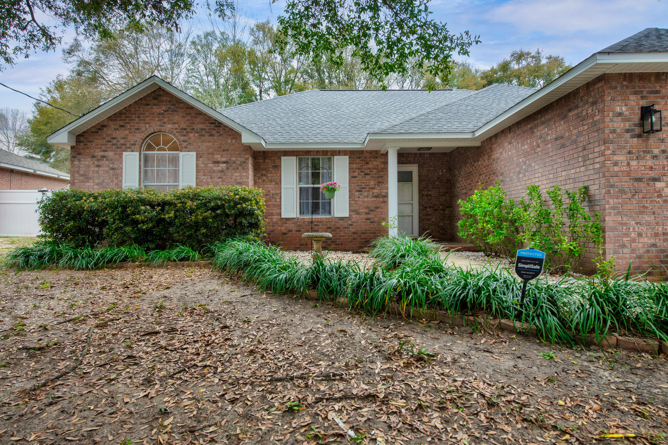4439 Antioch Road Crestview, FL 32536 - Photo 30 of 32 a front view of a house with garden