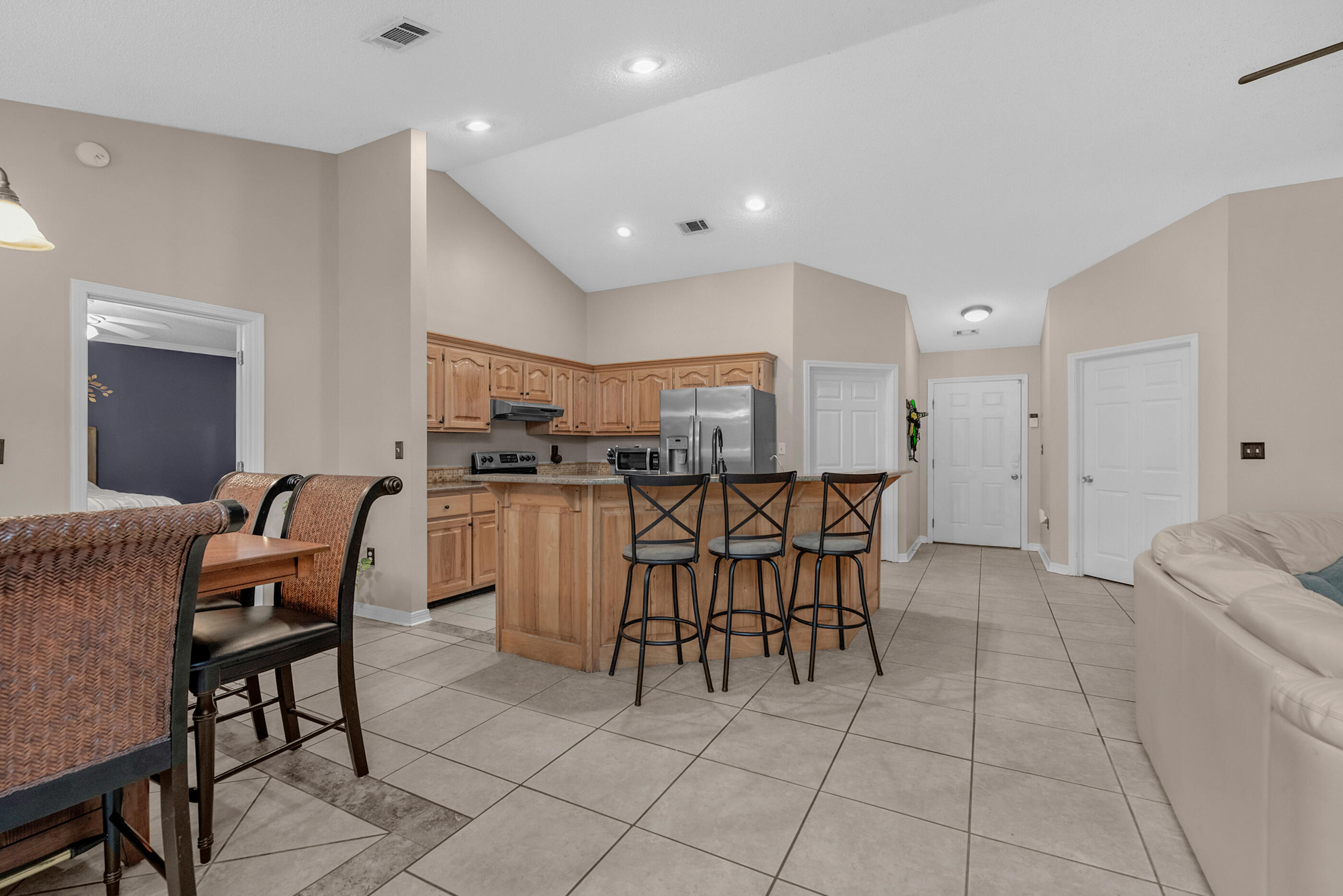 4439 Antioch Road Crestview, FL 32536 - Photo 3 of 32 a dining hall with stainless steel appliances a dining table and chairs