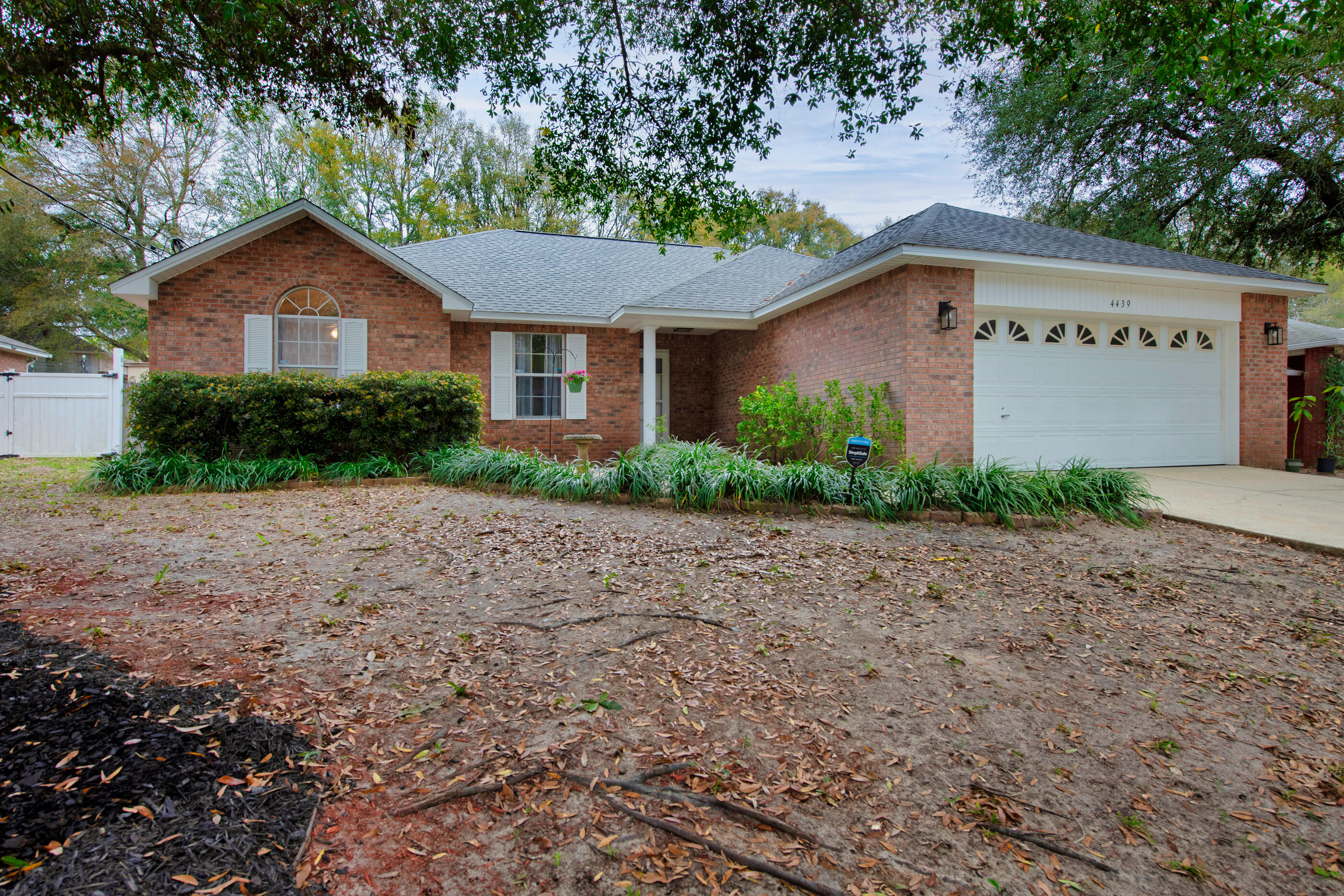 4439 Antioch Road Crestview, FL 32536 - Photo 32 of 32 a front view of a house with a yard and garage