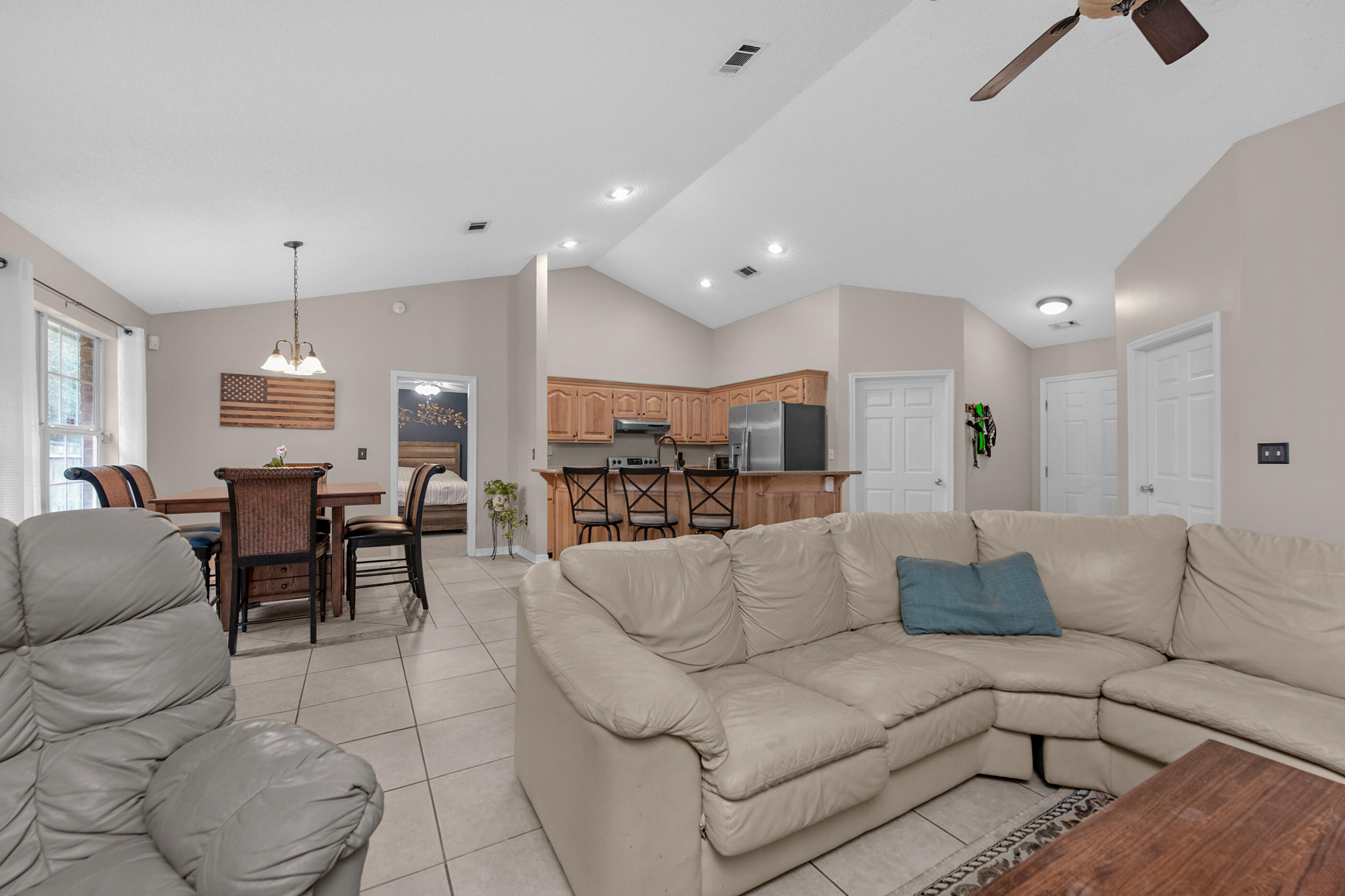 4439 Antioch Road Crestview, FL 32536 - Photo 4 of 32 a view of a living room kitchen and a dining table with kitchen view