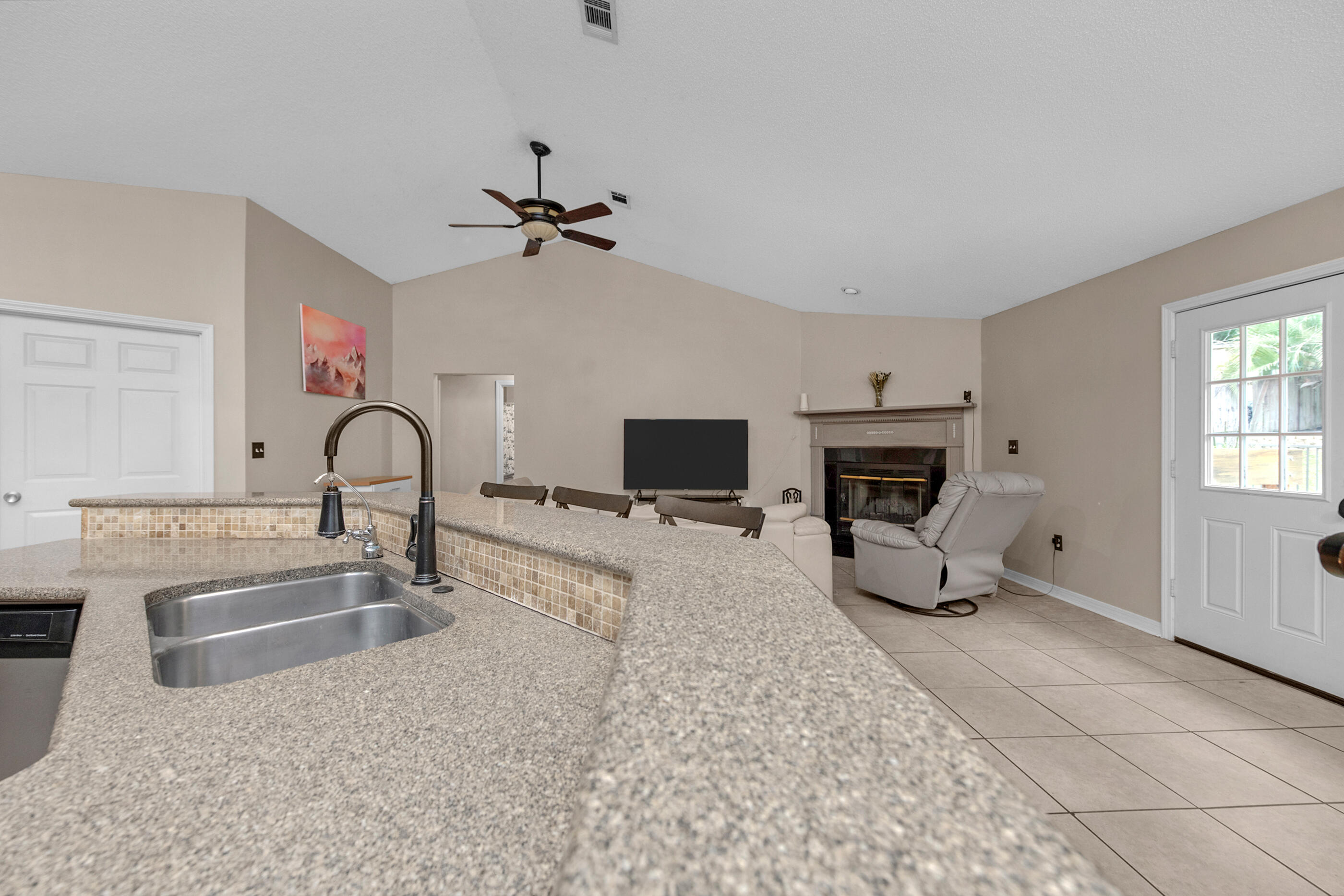 4439 Antioch Road Crestview, FL 32536 - Photo 9 of 32 a living room with furniture and a flat screen tv