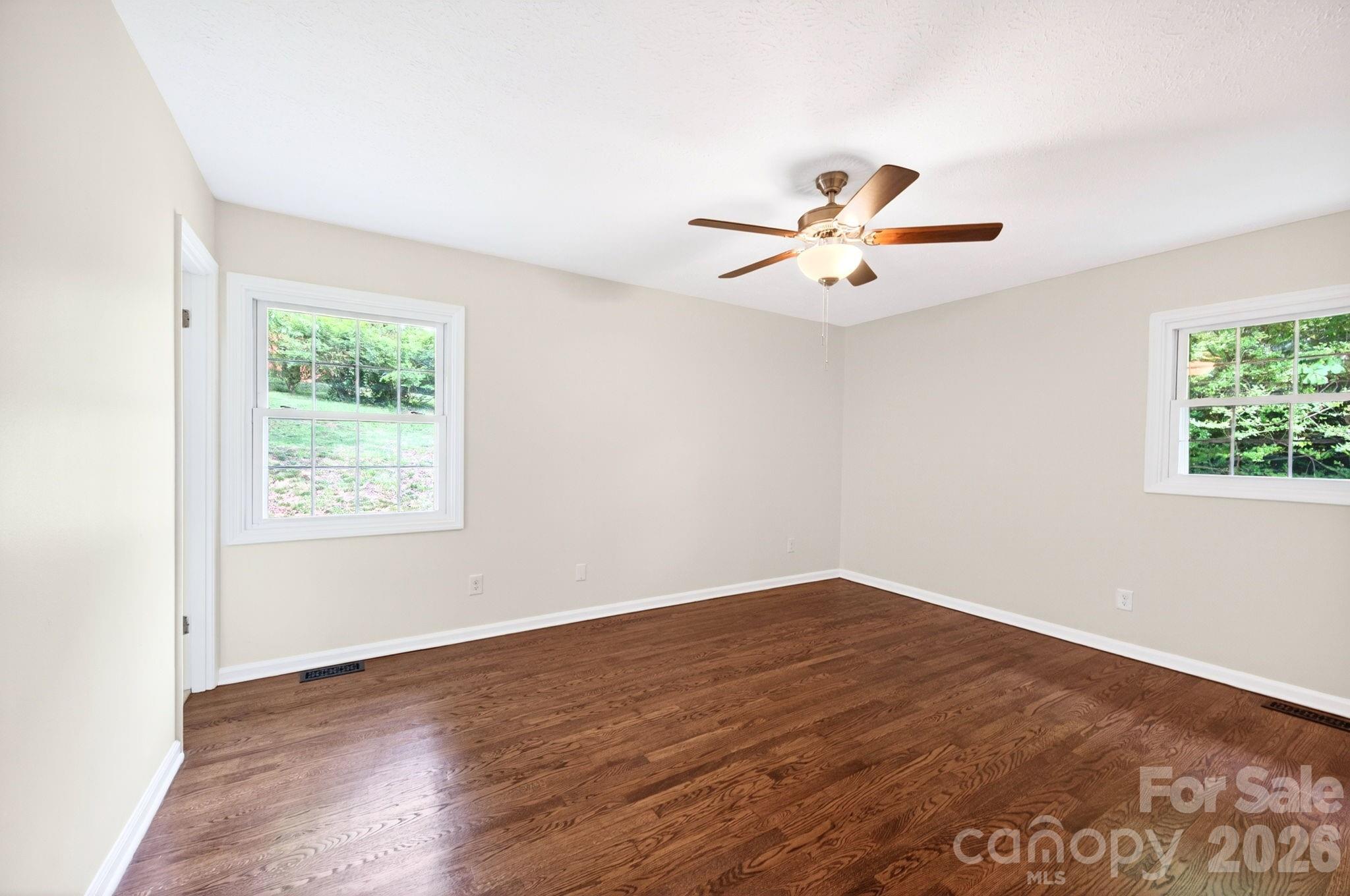 34 Wolfe Cove Road Asheville, NC 28804 - Photo 17 of 42 wooden floor in an empty room with a window