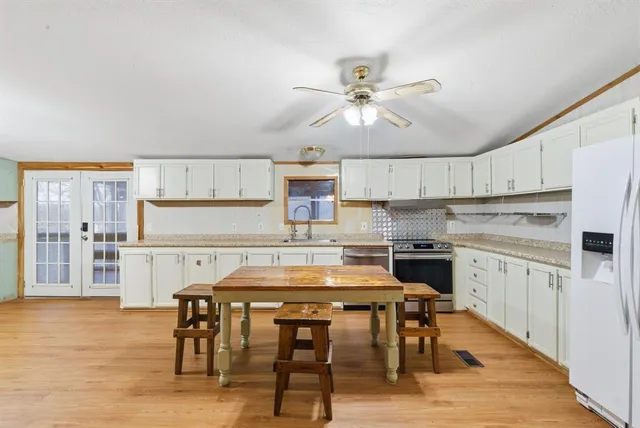 a view of a room with furniture and window