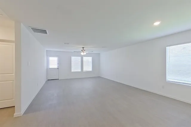 a view of empty room with windows