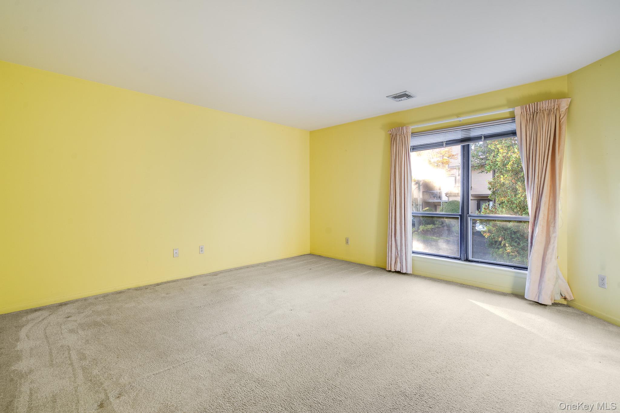 113 Antler Ridge, Unit 113 Ossining, NY 10562 - Photo 16 of 26 a view of an empty room with a window